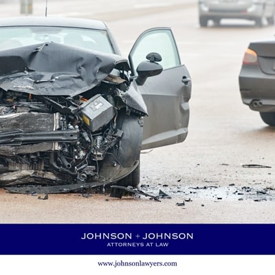 A totaled car sits on the highway with debris scattered all around after a car accident in Gilbert, SC