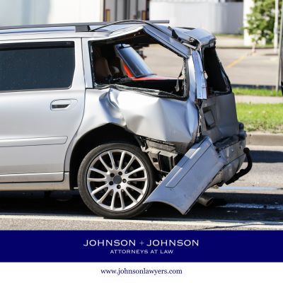 A severely damaged silver station wagon after a Pine Ridge car accident