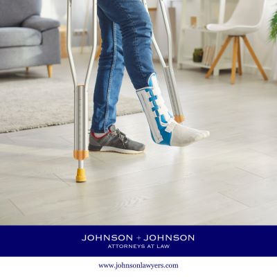 Injured person using crutches while wearing a medical walking boot.
