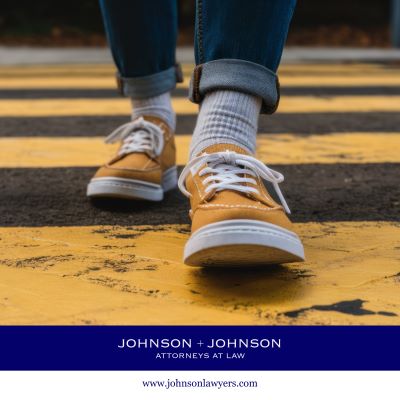 A close up of a pedestrian's feet in a crosswalk in Columbia, SC