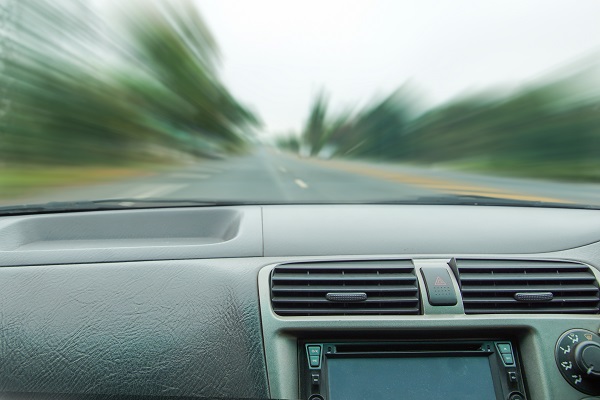 POV of a driver speeding with road motion blur.