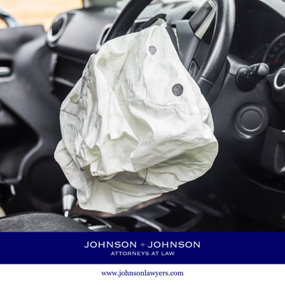 The drivers side of a car after a car accident in St. Matthews, with the deployed airbag visible